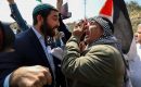 An Israeli settler and a Palestinian argue during a demonstration in support of Palestinians in Huwara in the West Bank city of Nablus on March 3, 2023. (Photo by Issam Rimawi/Anadolu Agency via Getty Images)