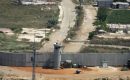 A road comes to a dead end in front of a part of Israel’s security barrier which surrounds the area of the West Bank Palestinian town of Qalqilya. (Photo by Joe Raedle/Getty Images)